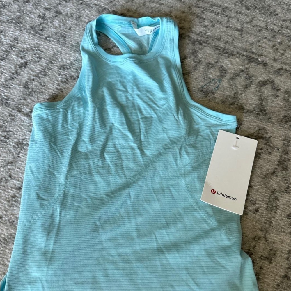 Lululemon icing blue  swiftly tech high neck tank 2.0 * Race 
Size 4
NWT